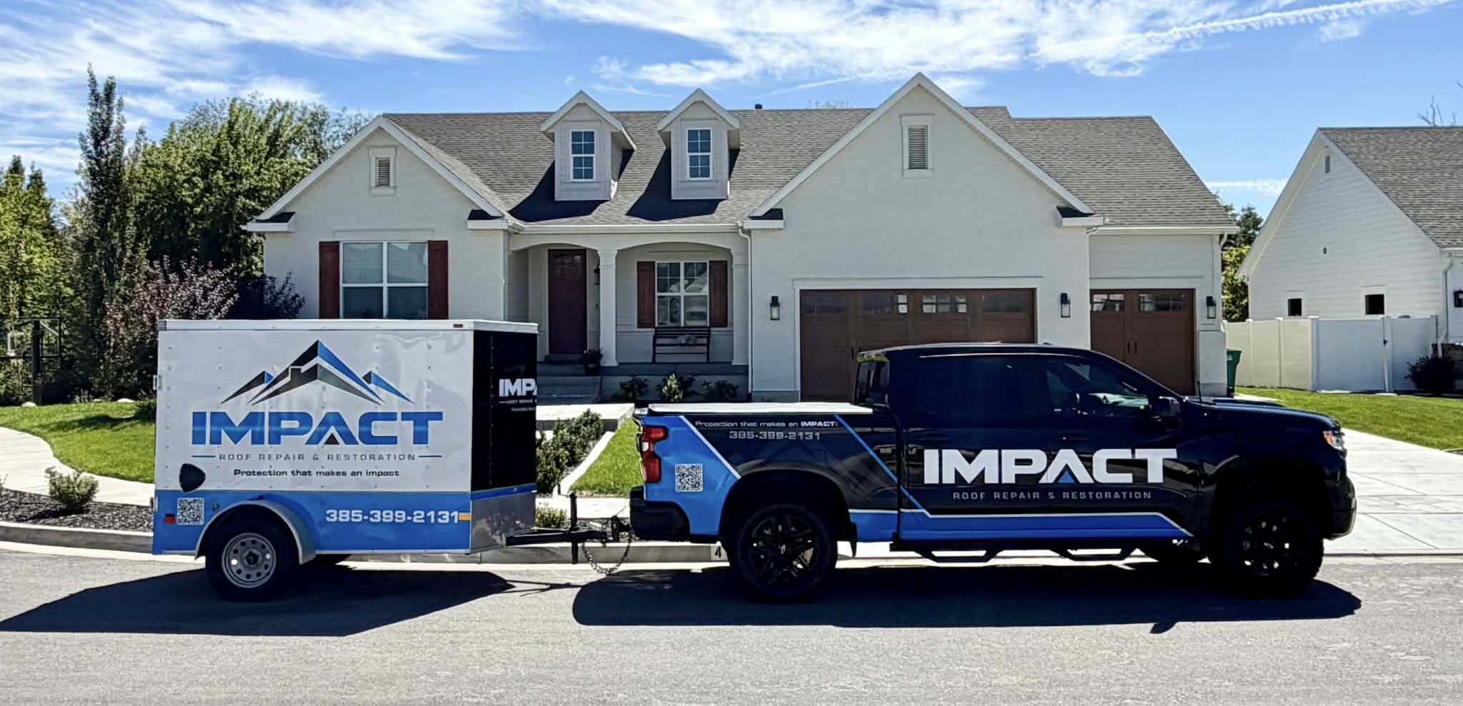 Impact Roofing and Restoration truck and trailer in a Utah neighborhood