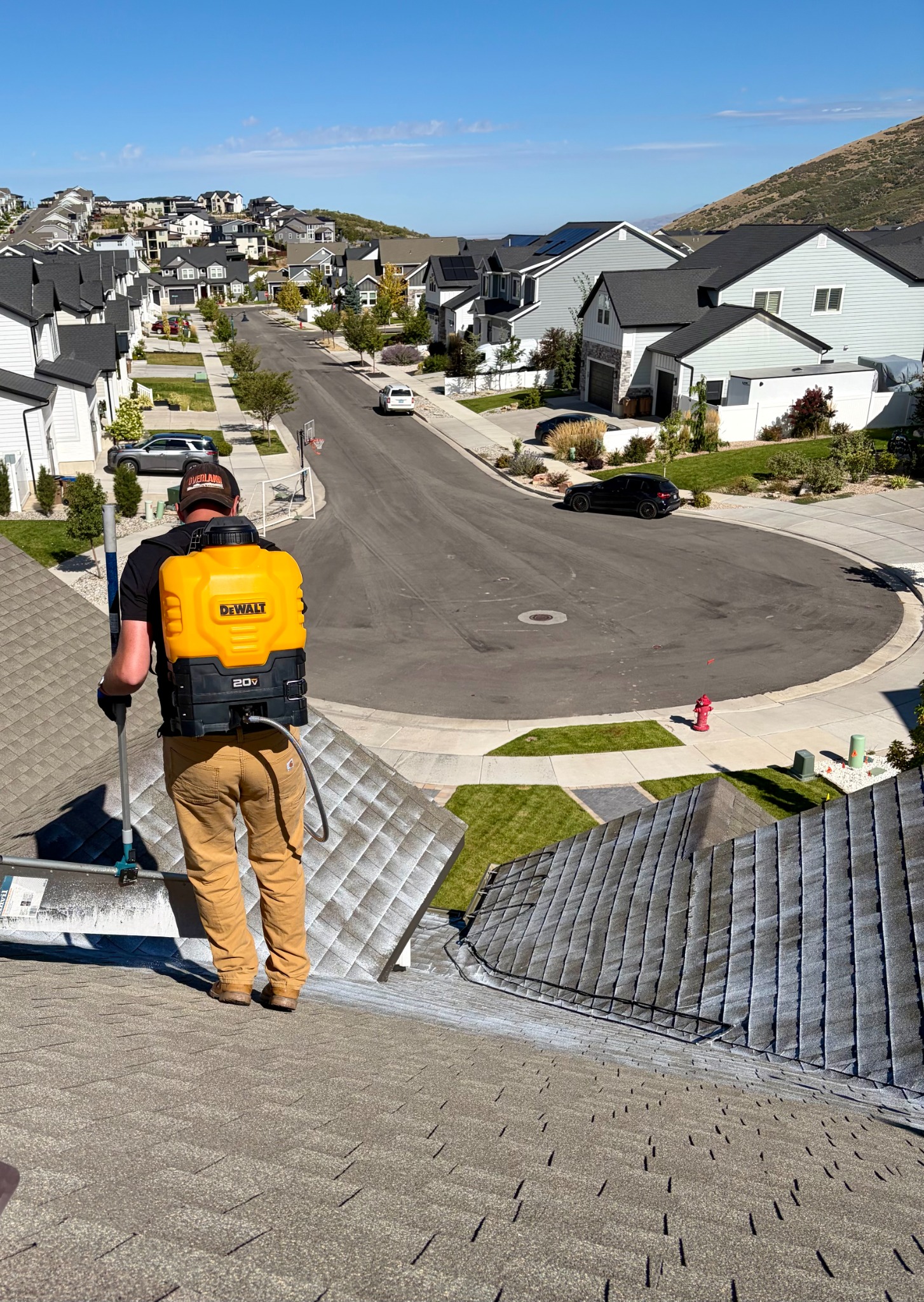 Impact roof specialist applying a roof restoration treatment